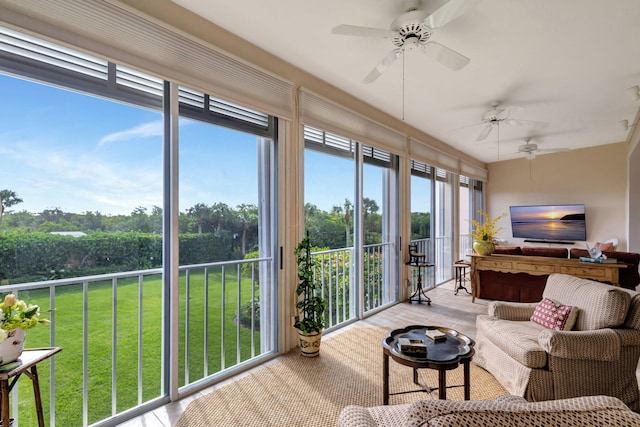 sunroom / solarium featuring ceiling fan and a wealth of natural light