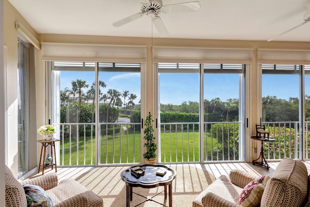 sunroom with ceiling fan and a wealth of natural light