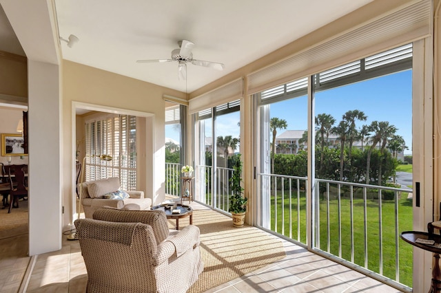 sunroom / solarium with ceiling fan