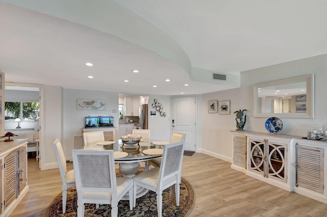 dining room with light hardwood / wood-style flooring