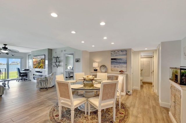 dining space featuring ceiling fan and light hardwood / wood-style flooring