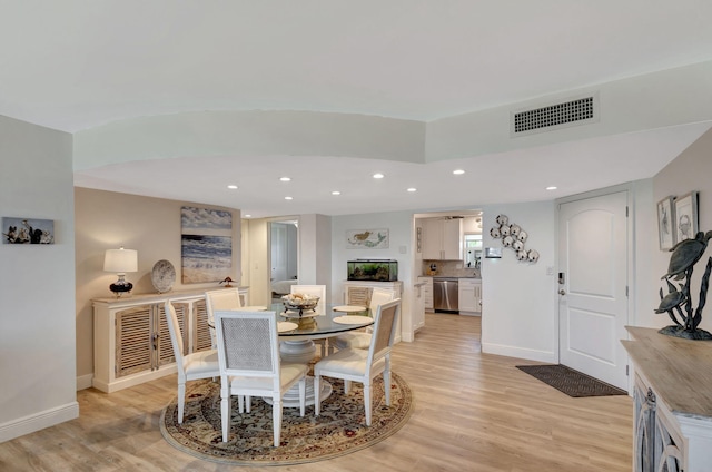 dining room with light hardwood / wood-style flooring