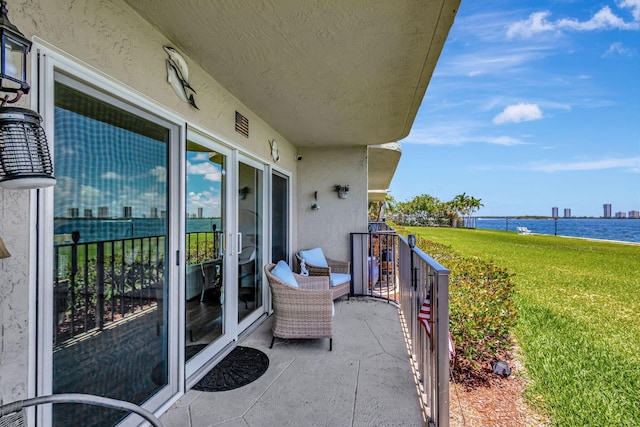 balcony featuring a water view