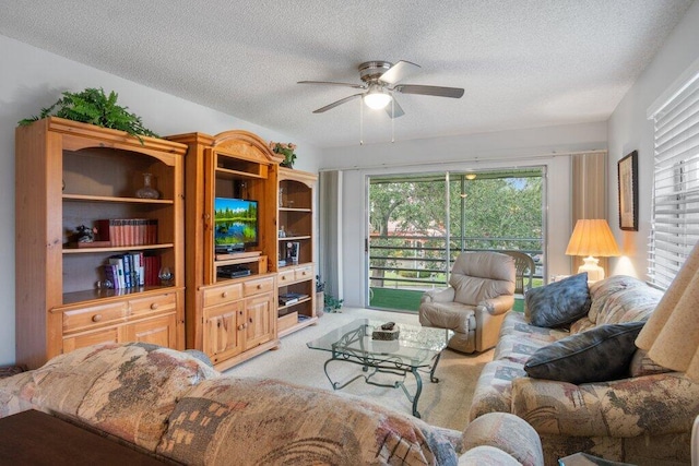 living room with light carpet, a textured ceiling, and ceiling fan