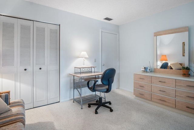 office space with a textured ceiling