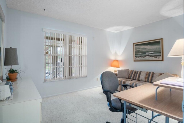 home office featuring a textured ceiling