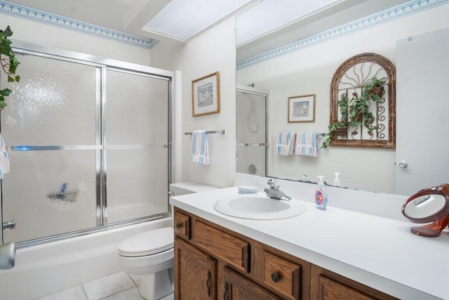 full bathroom with vanity, enclosed tub / shower combo, toilet, and tile patterned flooring