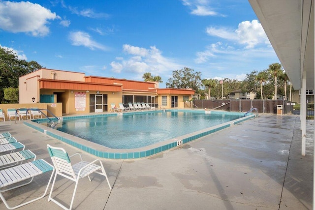 view of swimming pool with a patio