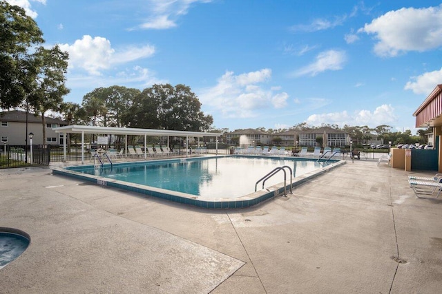 view of swimming pool featuring a patio area