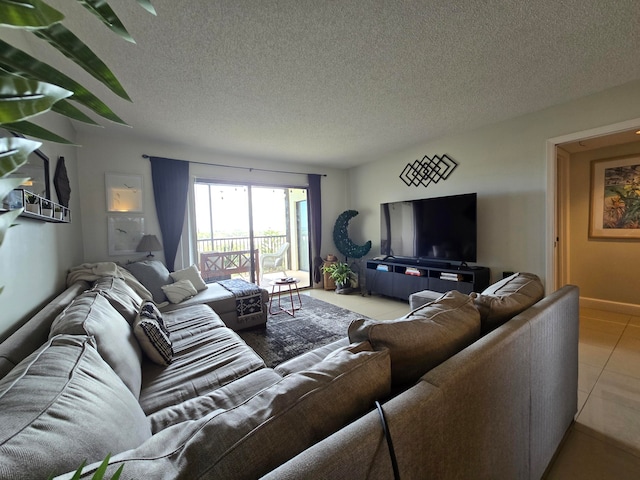 living room with a textured ceiling and tile patterned floors