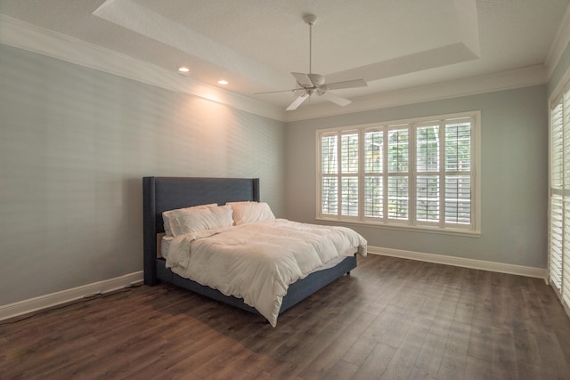 bedroom with ornamental molding, dark hardwood / wood-style floors, and ceiling fan