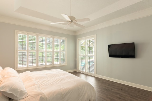 bedroom featuring dark hardwood / wood-style flooring, crown molding, multiple windows, and ceiling fan