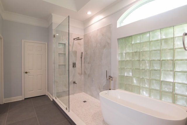 bathroom featuring crown molding, shower with separate bathtub, and tile patterned flooring