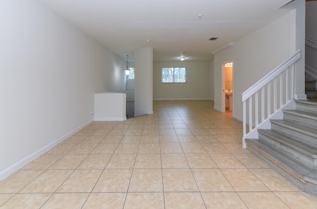 basement featuring light tile patterned flooring