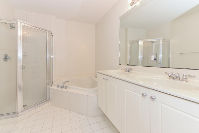 bathroom featuring vanity, shower with separate bathtub, and tile patterned flooring