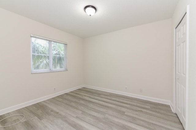 428 Bayfront Dr, Boynton Beach, FL 33435 - unfurnished bedroom featuring light wood-style floors, a closet, and baseboards