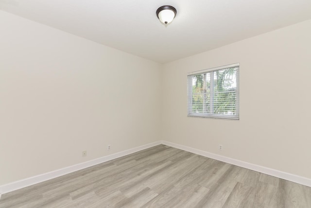 spare room featuring light hardwood / wood-style flooring