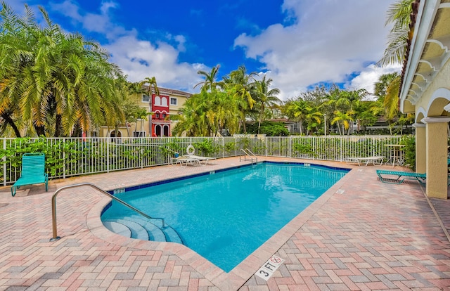 view of swimming pool featuring a patio area