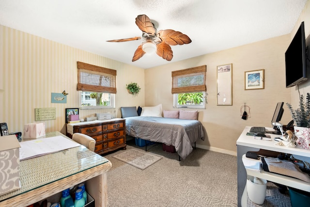 bedroom with light colored carpet and ceiling fan