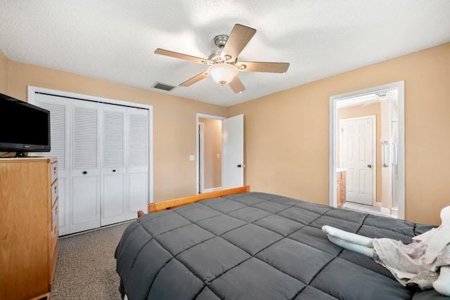 bedroom featuring ceiling fan, a textured ceiling, a closet, and carpet floors