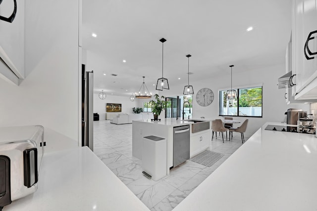 4478 SW 178th Ave Unit 4478, Miramar, FL 33029 - kitchen featuring stainless steel dishwasher, a sink, open floor plan, recessed lighting, and white cabinets
