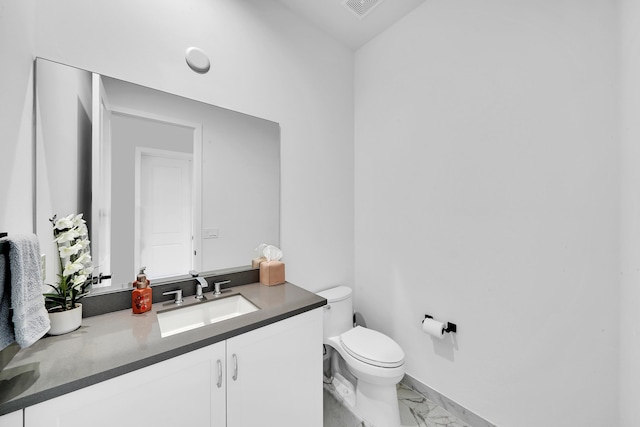 4478 SW 178th Ave Unit 4478, Miramar, FL 33029 - bathroom with marble look tiles, toilet, vanity, and baseboards