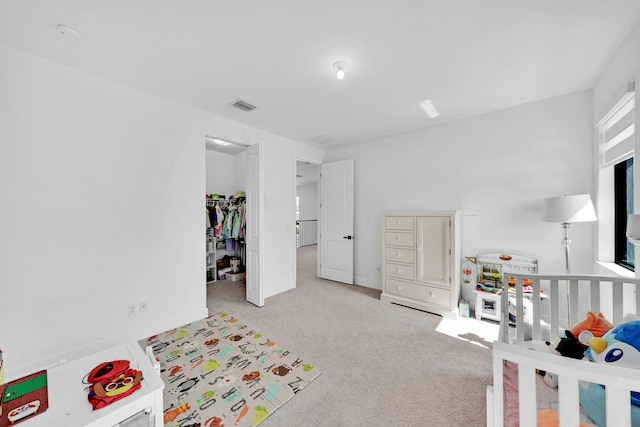 bedroom featuring light carpet