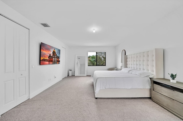 carpeted bedroom featuring a closet