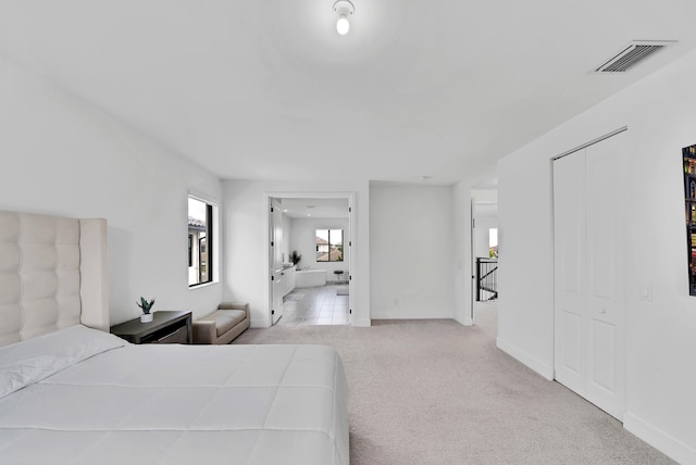 carpeted bedroom with a closet