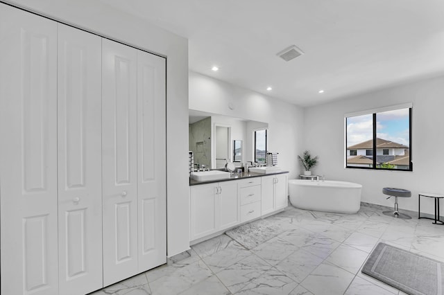 bathroom featuring vanity and shower with separate bathtub