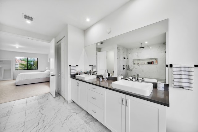 bathroom with walk in shower and vanity