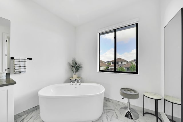 4478 SW 178th Ave Unit 4478, Miramar, FL 33029 - full bath with marble finish floors, a freestanding bath, baseboards, and vanity