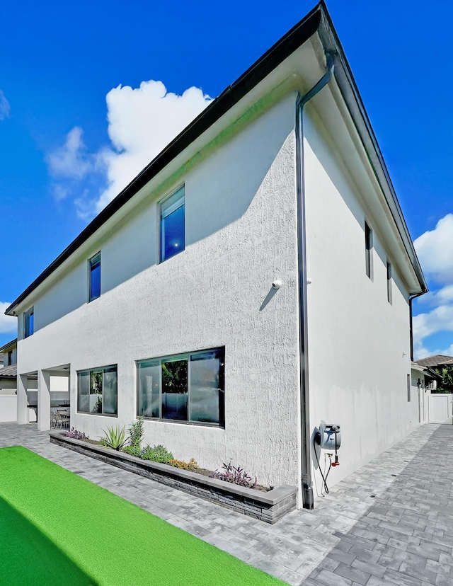 4478 SW 178th Ave Unit 4478, Miramar, FL 33029 - rear view of house with stucco siding and a patio