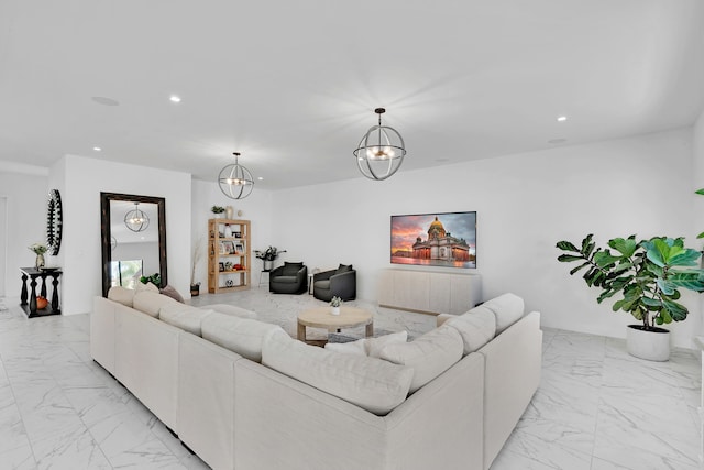 living room featuring a notable chandelier