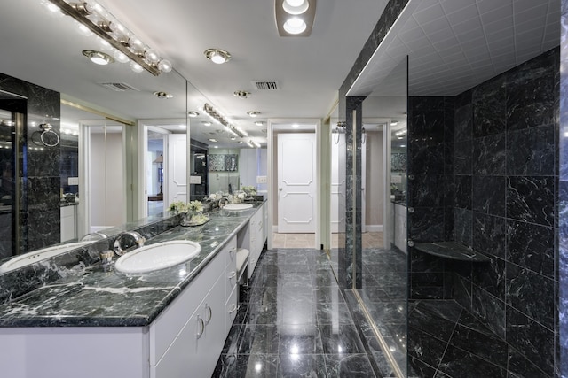 bathroom featuring vanity and tile walls