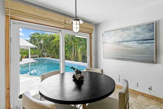 dining room featuring a textured ceiling