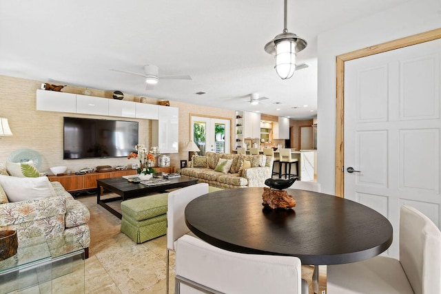 living room featuring french doors and ceiling fan