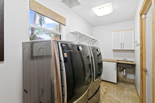 clothes washing area with separate washer and dryer