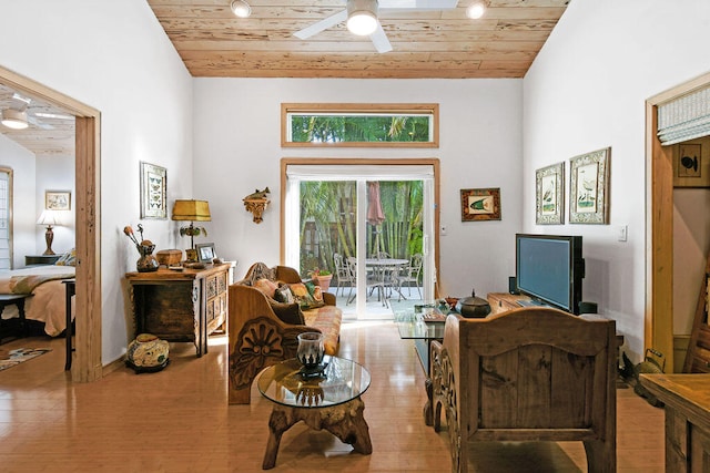 sitting room with wood ceiling, light wood-type flooring, and ceiling fan