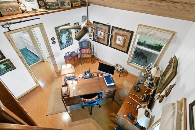 office with hardwood / wood-style floors and vaulted ceiling