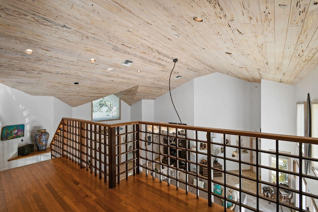 interior space with vaulted ceiling, wood ceiling, and wood-type flooring