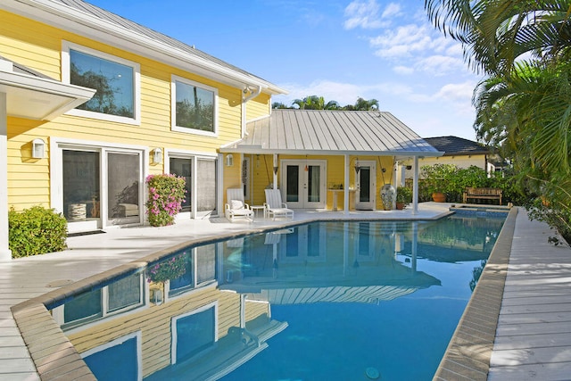 view of pool featuring a patio and an outdoor structure