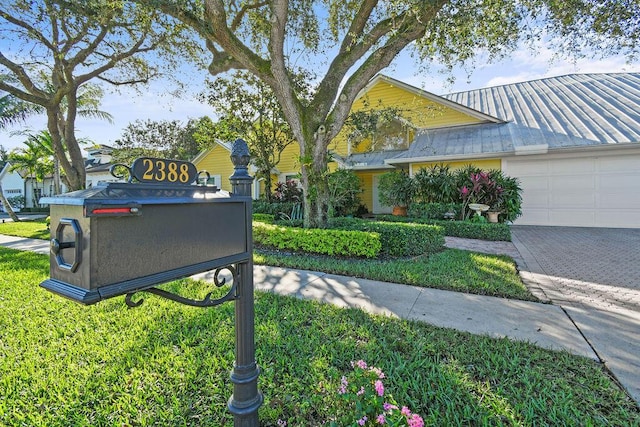 2388 Palm Harbor Dr, Palm Beach Gardens, FL 33410 - exterior view of metal roof, a standing seam roof, and driveway