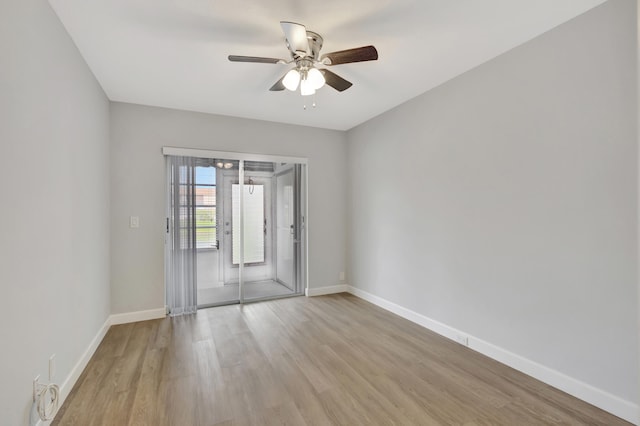 unfurnished room with ceiling fan and light wood-type flooring