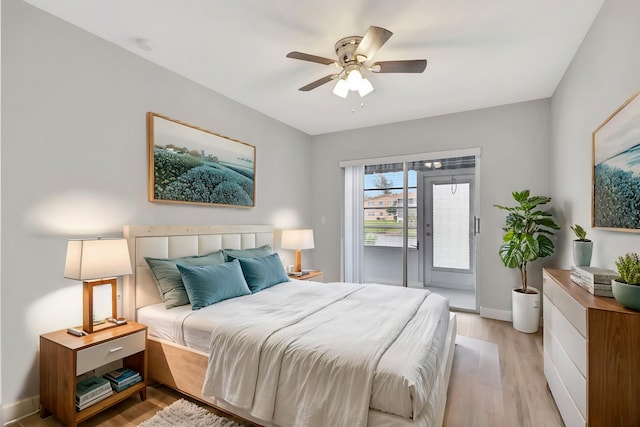 bedroom with ceiling fan, light hardwood / wood-style flooring, and access to exterior