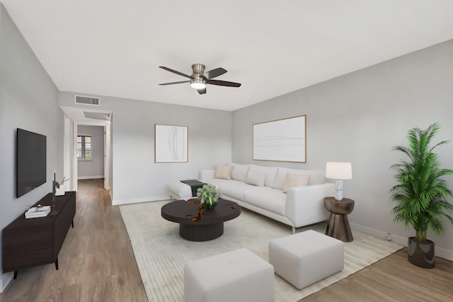 living room featuring ceiling fan and wood-type flooring