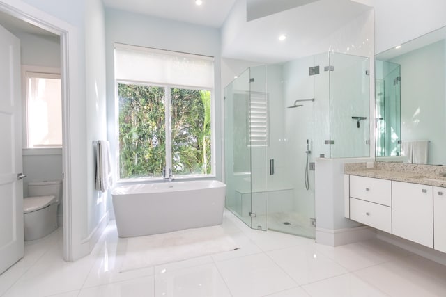 full bathroom with toilet, vanity, independent shower and bath, and tile patterned floors