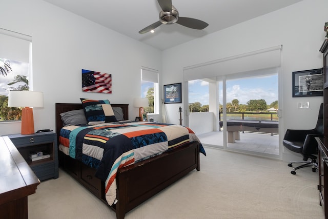 bedroom featuring light carpet, access to exterior, multiple windows, and ceiling fan