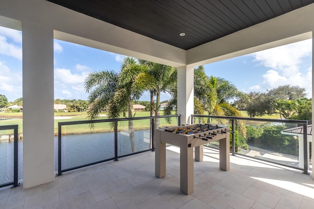 view of patio featuring a water view