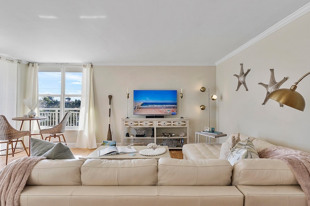 living room with hardwood / wood-style flooring and ornamental molding